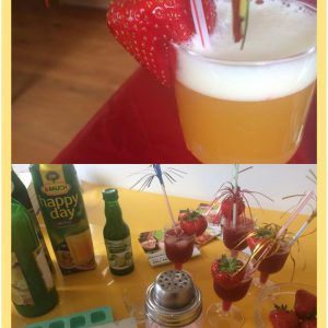 Eine Collage zeigt zwei Bilder: Das obere zeigt ein sprudelndes Orangengetränk in einem klaren Glas mit einer Erdbeere und einem festlichen Strohhalm; das untere zeigt Zutaten, einen Shaker und mehrere Gläser mit roten Getränken, Erdbeeren und Strohhalmen.